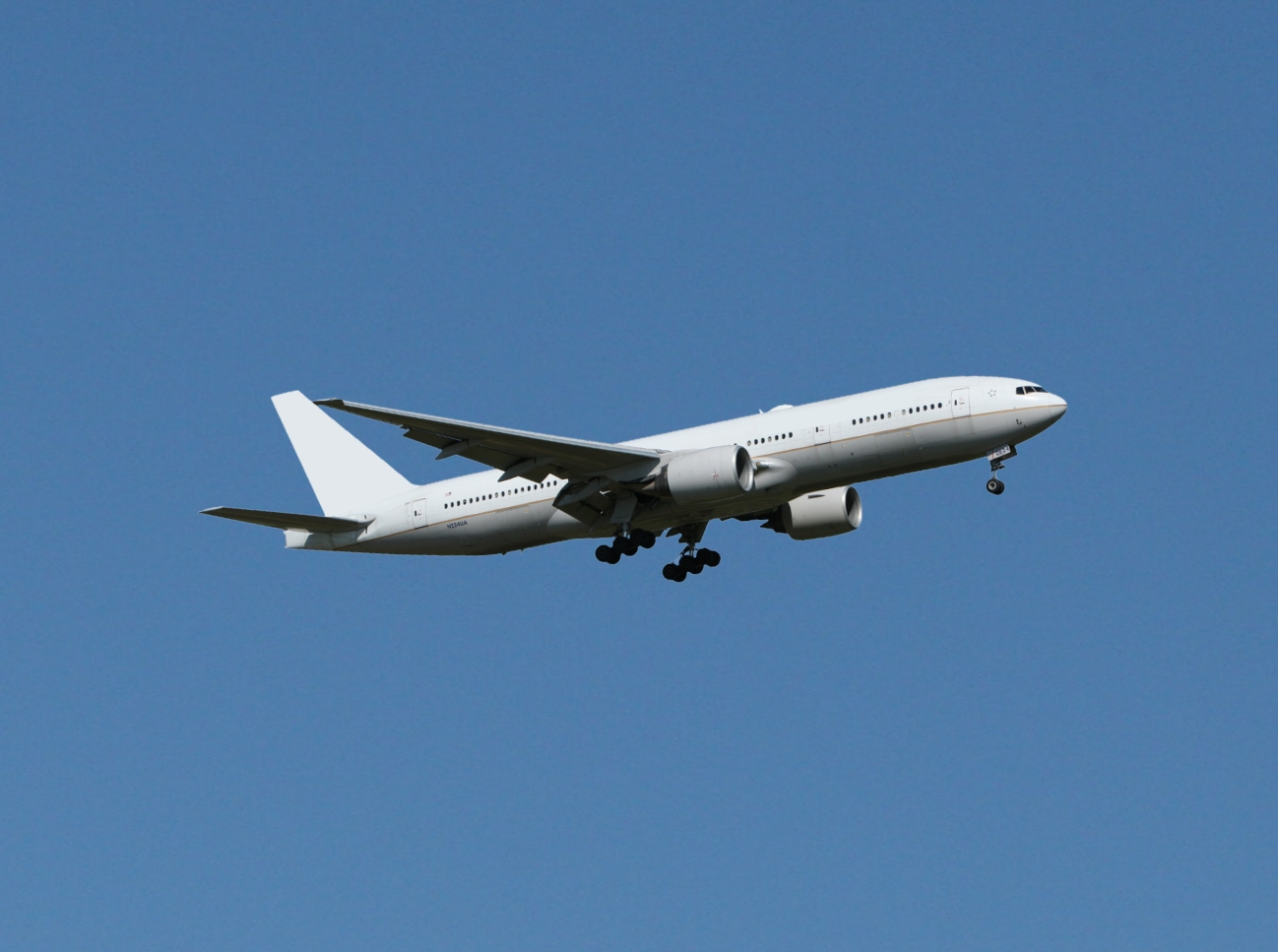 Airliner at passenger boarding dock gate